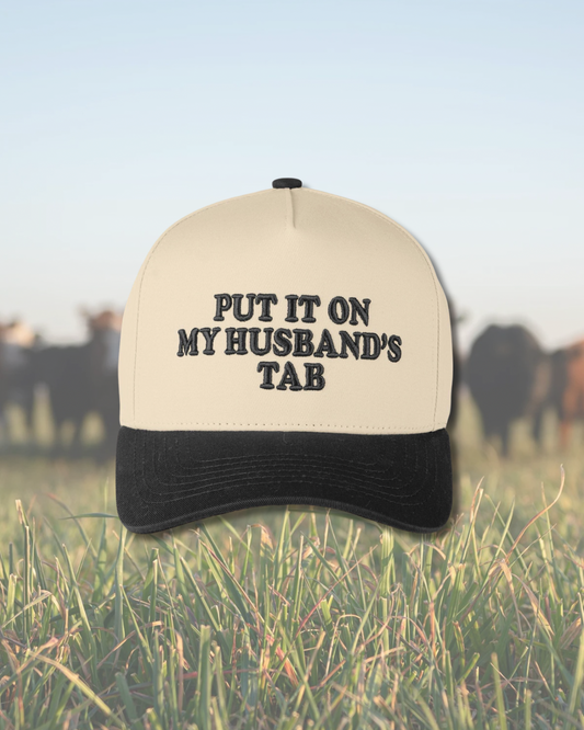 Black Put it on my Husband’s Tab Embroidered SnapBack Trucker Hat