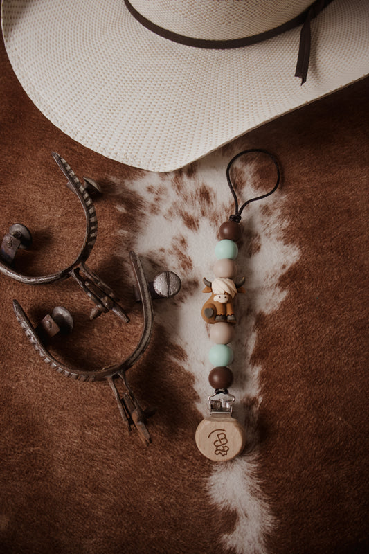 Blue Highland Cow Paci Clip